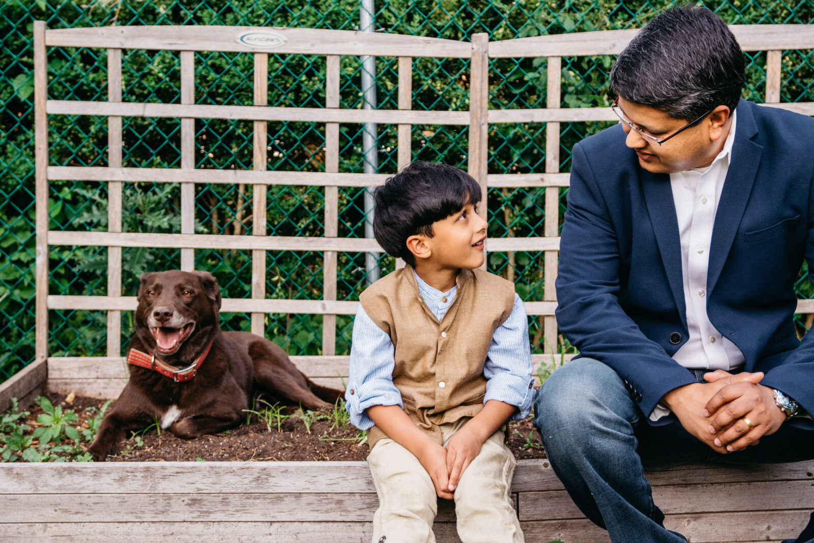 Man with his son and dog